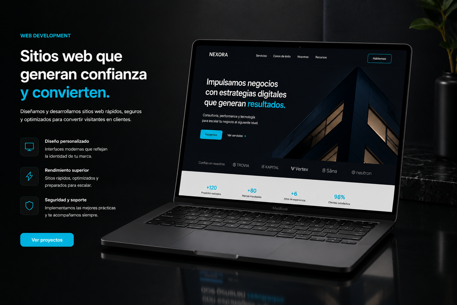 MacBook mostrando una web corporativa premium "Sitios web que generan confianza y convierten" sobre superficie oscura con reflejo